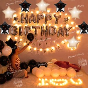 Complete Black and White Decoration Set featuring banners, foil balloons, tea light candles, and fairy lights