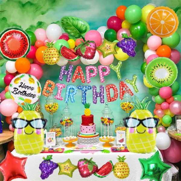 Tropical Fruits-themed birthday party decorations featuring pineapple, watermelon, orange, kiwi, and leaf-shaped foil balloons, vibrant latex balloons, and a Happy Birthday foil balloon set for a colorful and fun celebration."