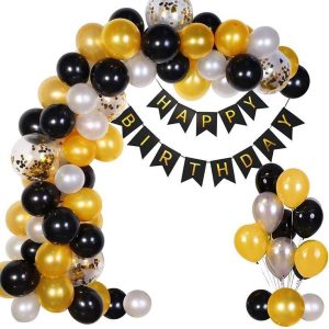 A cheerful birthday Golden & Black setup with a "Happy Birthday" banner, colorful balloons, confetti balloons, and glowing fairy lights.